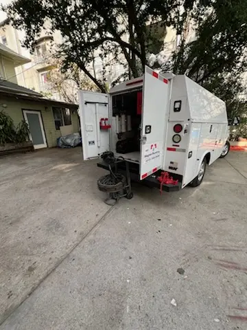 Magnet Plumbing service vehicle on-site for Grease Trap Cleaning in Encino